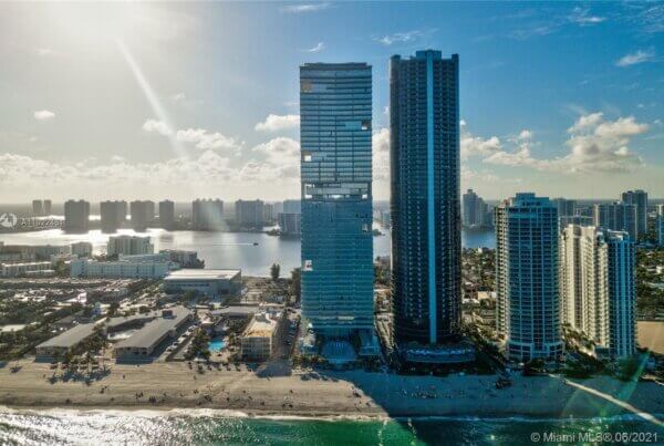 A view of the ocean and buildings from above.