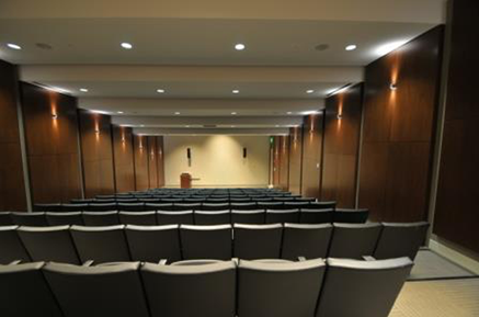 A room with many chairs and a podium