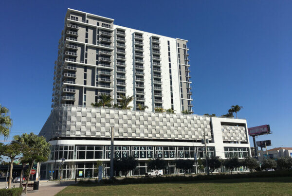 A large white building with a tall tower.