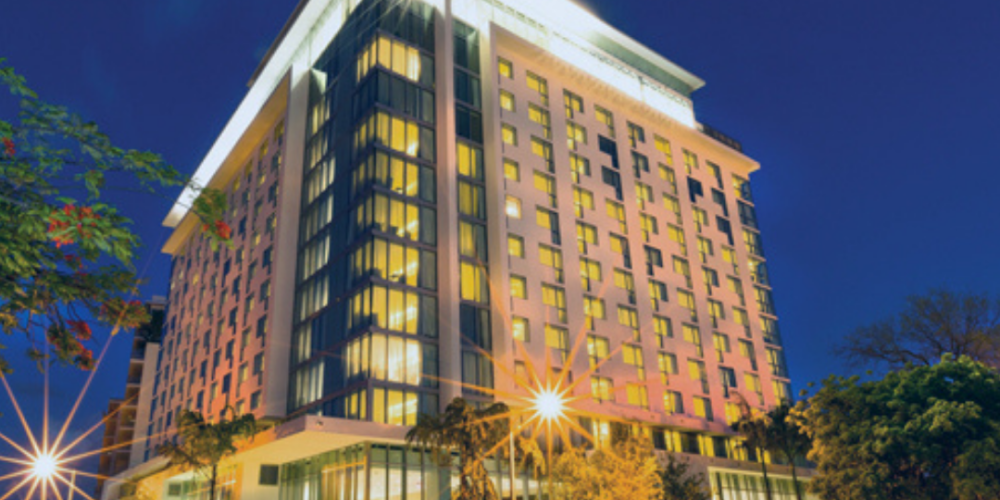 A large building with lights on the top of it.