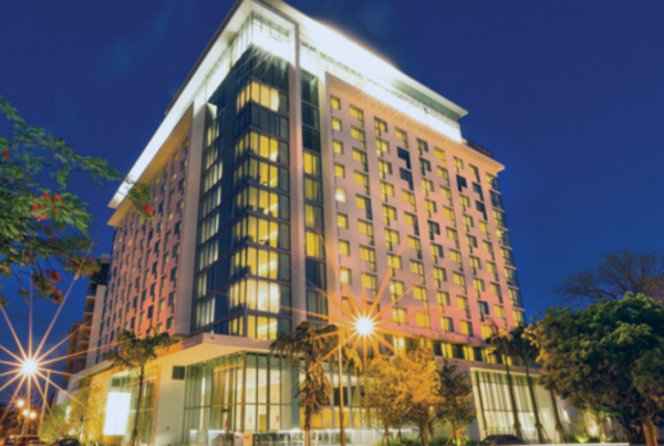 A large building with lights on the top of it.