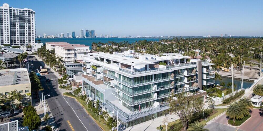 A view of the ocean and buildings from above.