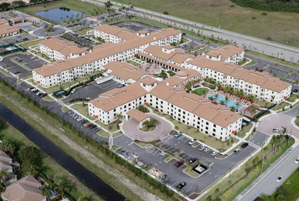 An aerial view of a residential area with lots of parking.